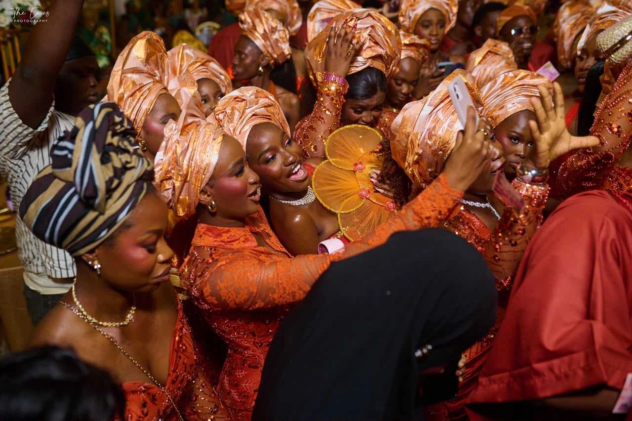 Guests celebrating in coordinated orange attire